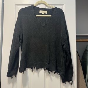 Grey ripped v neck sweater, stripe down side